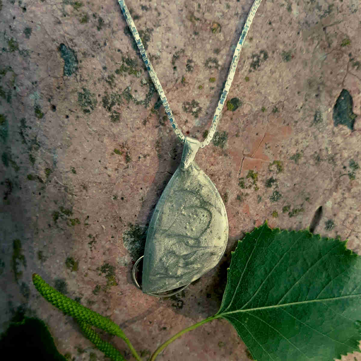 back of "crescent" style birch bark pendant with silver
