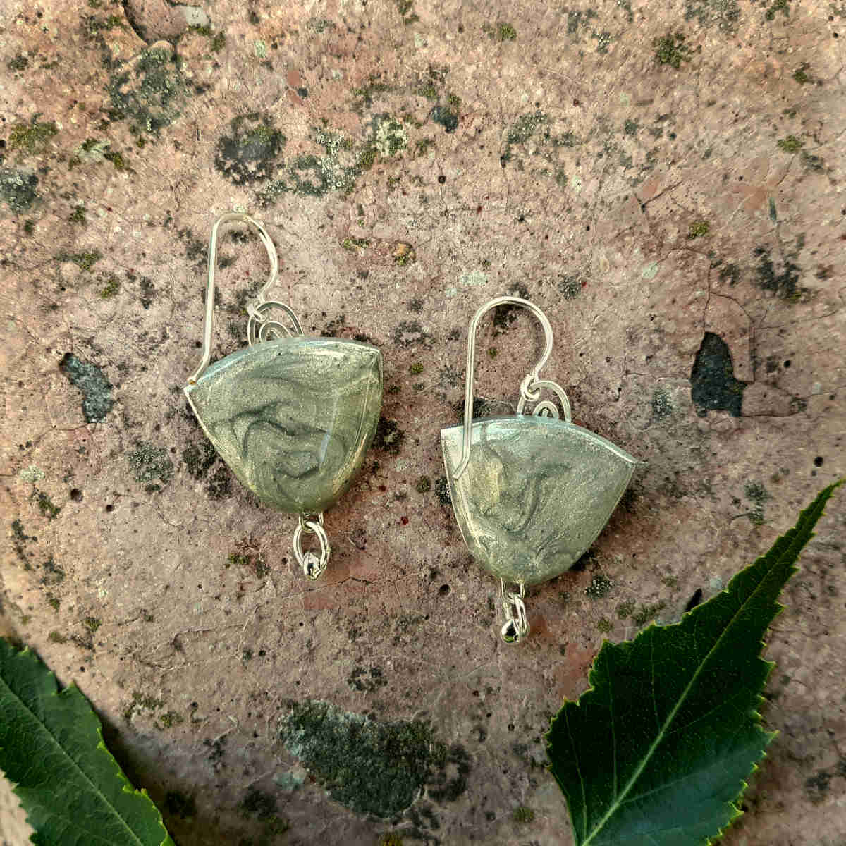 back of "half oval + bead" style birch bark earrings with silver